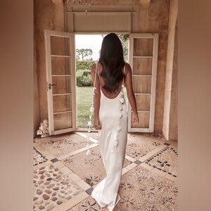 Brand new dress with a slight train on the back.